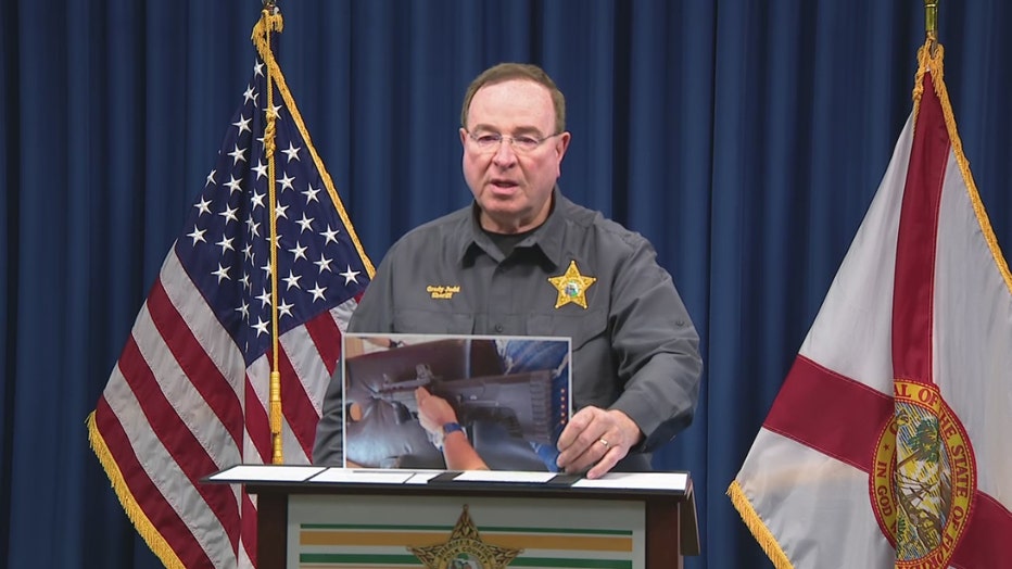 Pictured: Sheriff Grady Judd speaks at a news conference on April 18, 2025, showing a gun he says one of the suspects in an organized retail theft ring possessed.