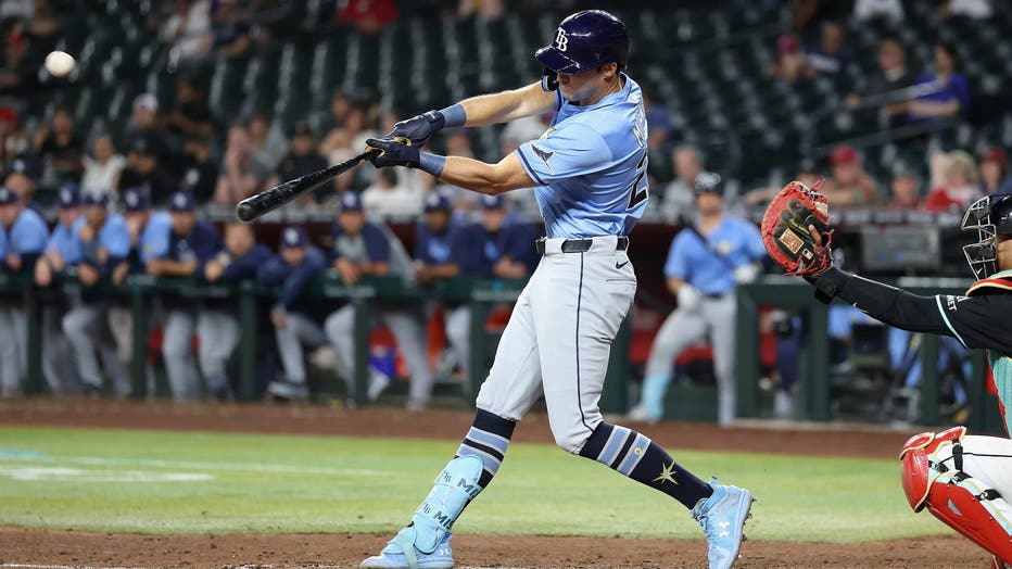 PHOENIX, ARIZONA - APRIL 23: Kameron Misner #26 of the Tampa Bay Rays hits a RBI double against the Arizona Diamondbacks during the 11th inning of the MLB game at Chase Field on April 23, 2025 in Phoenix, Arizona. The Rays defeated the Diamondbacks 7-6 in 11 innings. (Photo by Christian Petersen/Getty Images)