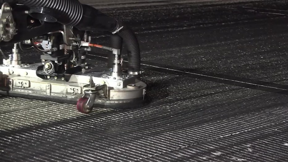 The removal of rubber buildup is crucial, as it prevents hydroplaning and ensures that aircraft can stop safely upon landing.