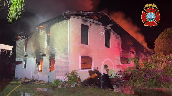 Video: Crews battle large fire at Tampa home