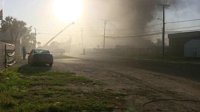 3 Tampa families displaced after fire sparks at mechanic shop, scrapyard facility