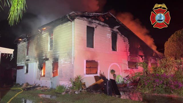 Video: Crews battle large fire at Tampa home