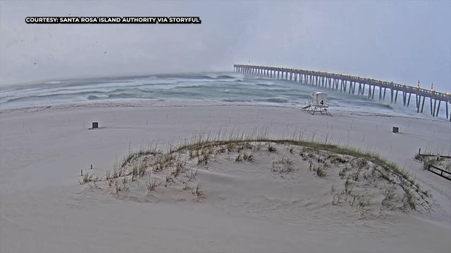 Watch: Large waterspout comes ashore along Florida beach