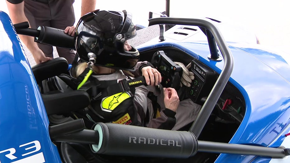 Pictured: Marta Hansen behind the wheel of a Radical race car.