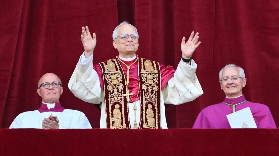 Newly elected Pope Leo XIV, Robert Prevost arrives on the main central loggia balcony of the St Peter's Basilica for the first time, after the cardinals ended the conclave, in The Vatican, on May 8, 2025. Robert Francis Prevost was on Thursday elected the first pope from the United States, the Vatican announced. A moderate who was close to Pope Francis and spent years as a missionary in Peru, he becomes the Catholic Church's 267th pontiff, taking the papal name Leo XIV. (Photo by Alberto PIZZOLI / AFP) (Photo by ALBERTO PIZZOLI/AFP via Getty Images)