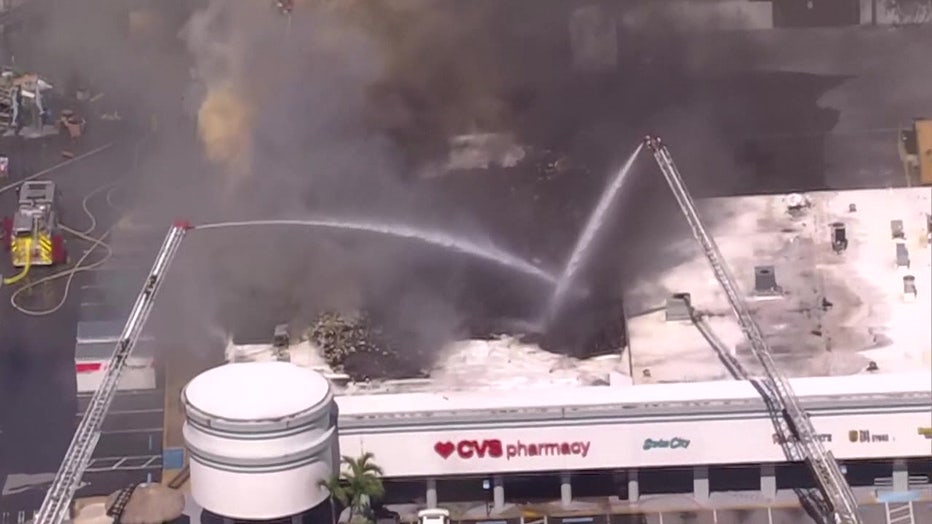 A massive three-alarm fire tore through a CVS on Gulf Boulevard in St. Pete Beach on Tuesday afternoon, forcing nearby stores to evacuate.