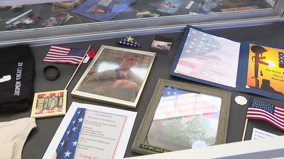 Throughout the month of May, a display at the local library in Dunedin reminds people of Spc. Zachary L. Shannon, the hero who called Dunedin home.