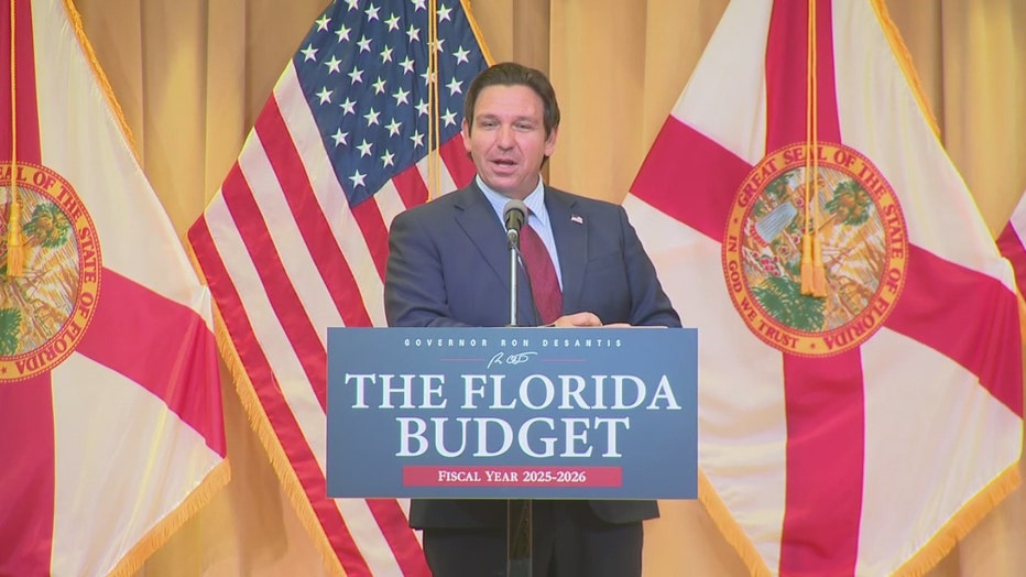 Pictured: Gov. Ron DeSantis speaks at a news conference in Wildwood on June 30, 2025.