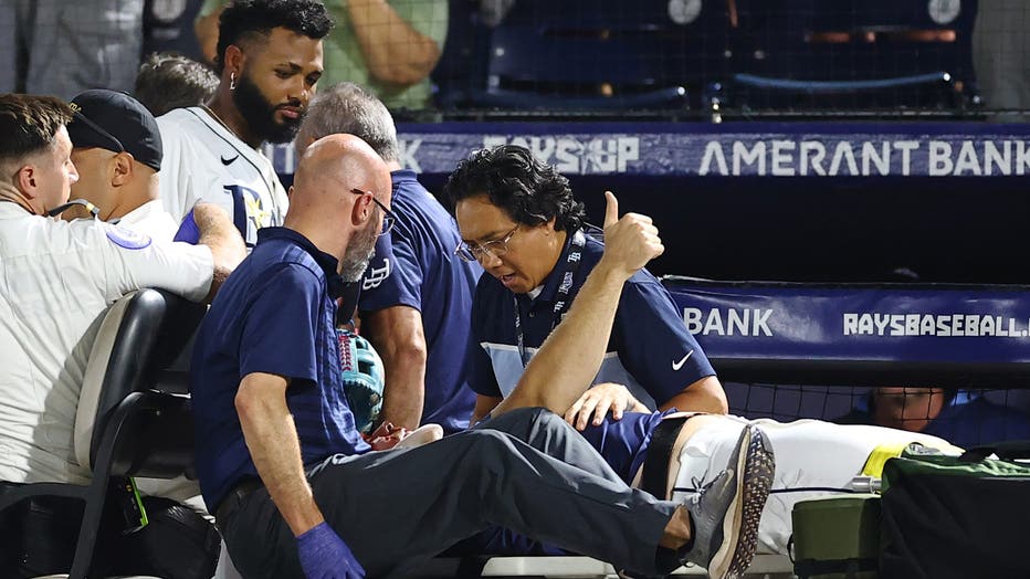 TAMPA, FLORIDA - JUNE 19: Hunter Bigge #43 of the Tampa Bay Rays gives a thumbs up after getting hit by a foul ball off the bat of Adley Rutschman of the Baltimore Orioles (not pictured) in the seventh inning at George M. Steinbrenner Field on June 19, 2025 in Tampa, Florida. (Photo by Julio Aguilar/Getty Images)