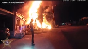 Video: Florida couple, dog rescued from burning mobile home