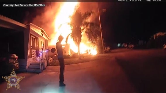 Video: Florida couple, dog rescued from burning mobile home