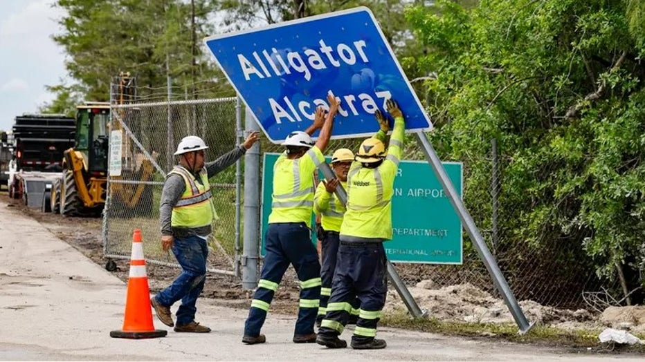 Workers install a permanent Alligator Alcatraz sign. The facility is within the Florida Everglades, 36 miles west of the central business district of Miami, in Collier County. Florida, on Thursday, July 3, 2025. (Getty Images)