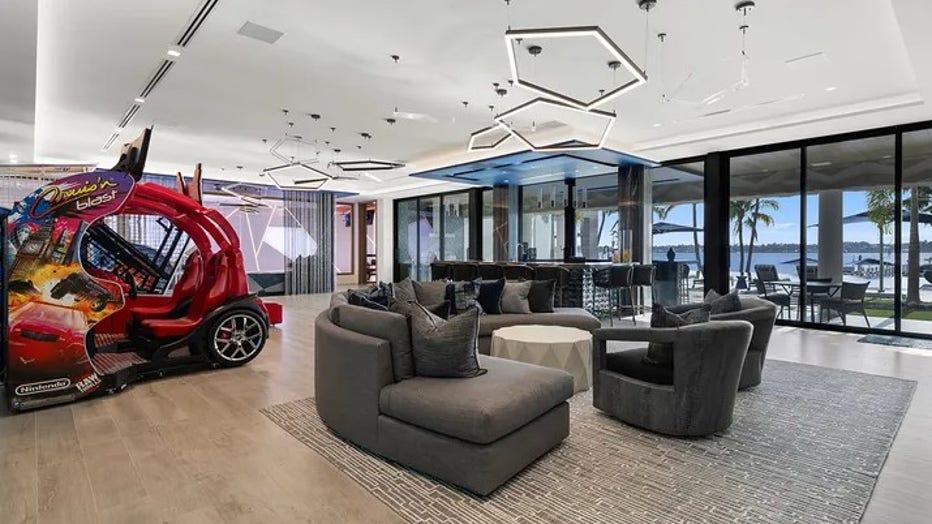 The game room features arcade games and another seating area. (Legendary Productions / Luxury Resort Portfolio)