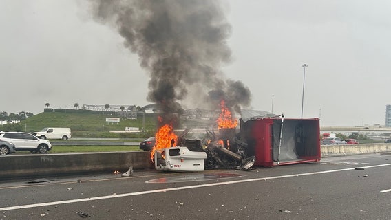 Tractor-trailer bursts into flames after slamming into median