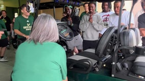 USF men's basketball team gives back to long-time team administrative specialist