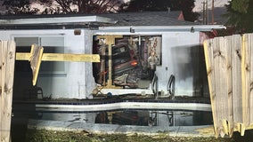 4, including child, taken to hospital after car crashes into Holiday home