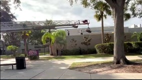 Roofer injured on school building after falling 20 feet, rescued by Pasco County fire truck