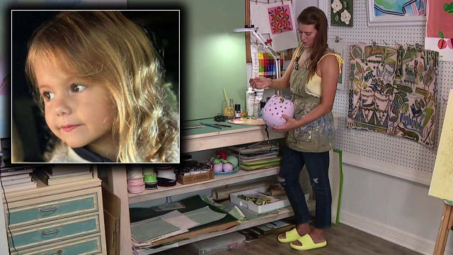 Artist painting helmet for South Tampa girl recovering from viral meningitis, severe encephalitis