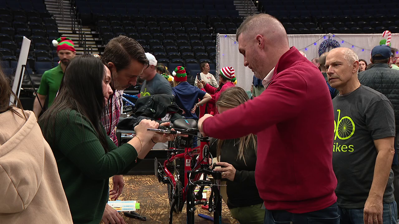 Benchmark Arena becomes Santa's workshop as volunteers assemble 1,000 bikes