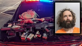 Driver found with multiple weapons, container with radioactive warning label arrested in Polk County