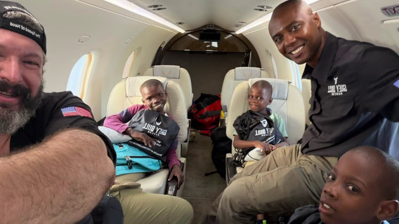 Haitian boys united with adoptive family at Tampa International Airport