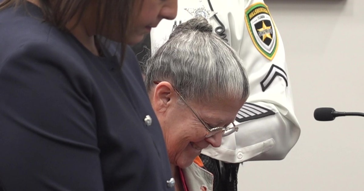 Convicted killer smiles, laughs as judge hands down life sentence for murdering sister and burying her in yard