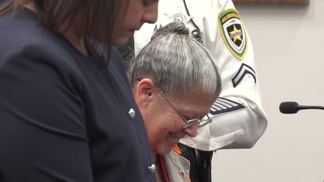 Convicted killer smiles, laughs as judge hands down life sentence for murdering sister and burying her in yard