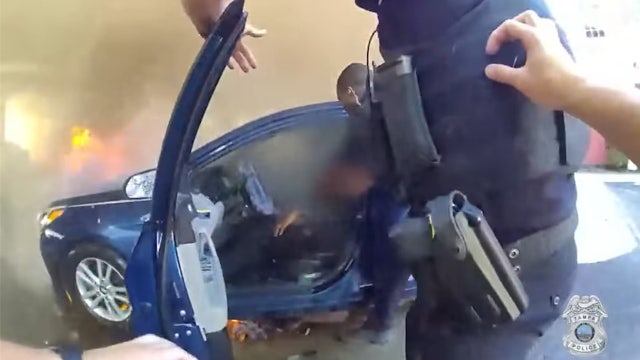 Tampa officers rescue man from burning car after medical emergency leads to crash