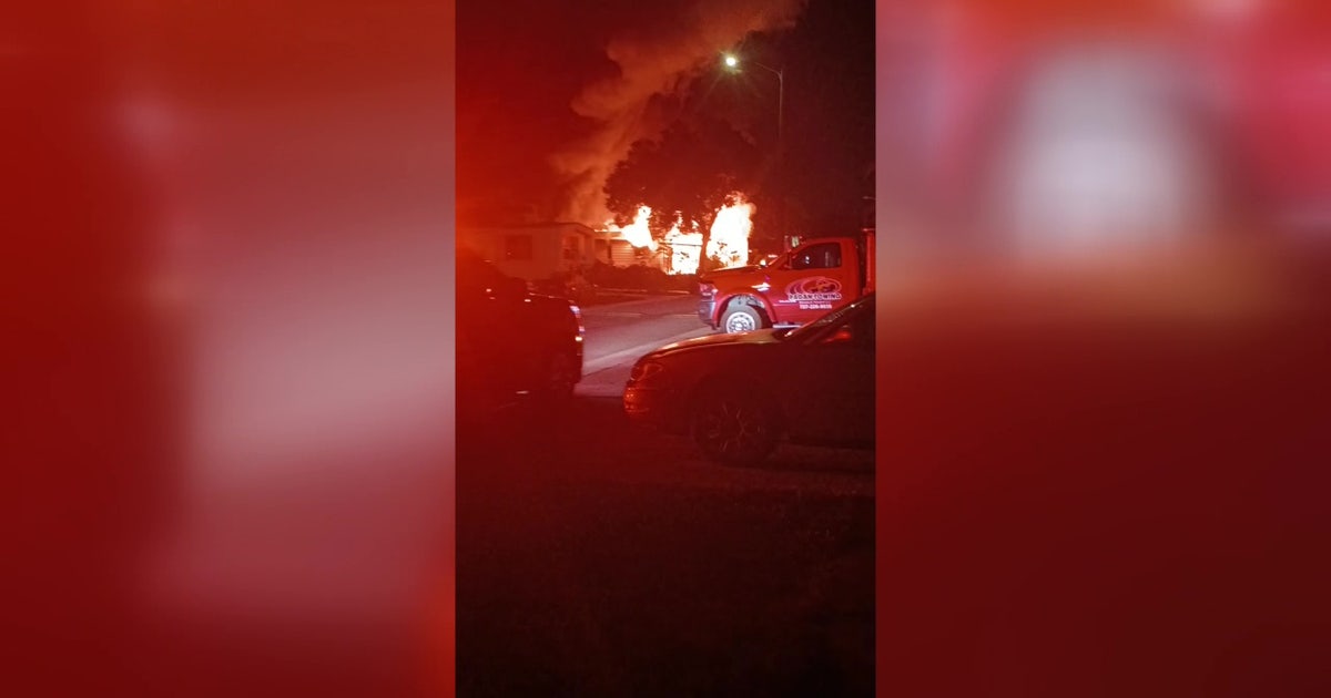 Massive mobile home fire in Largo leaves 1 hospitalized, possible fatalities reported