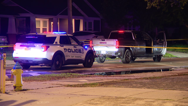 Tampa police investigating related scenes after man found dead in vehicle, woman dies in burned home