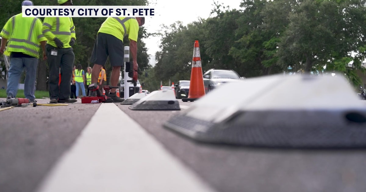 Crews place protective dividers along St. Petersburg bike lanes