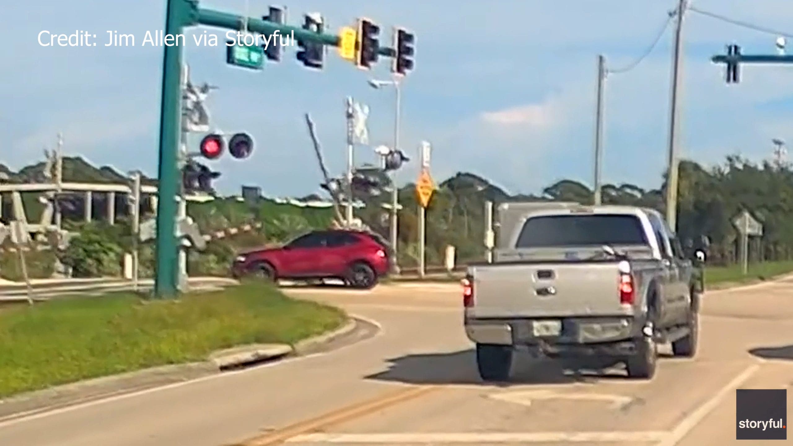 Video: Man saves woman trapped on Florida train tracks with seconds to spare
