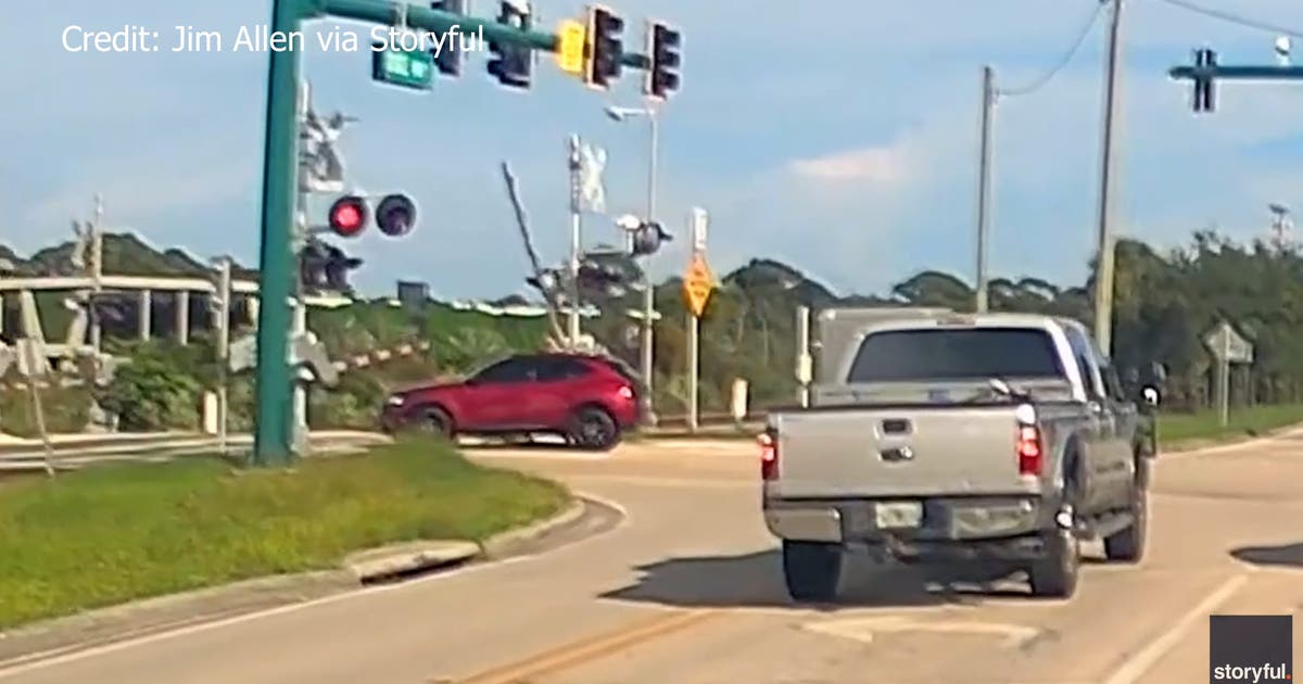 Video: Man saves woman trapped on Florida train tracks with seconds to spare