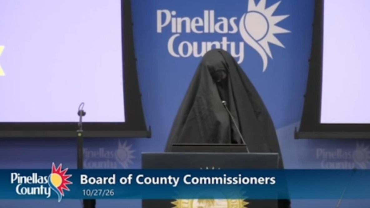 Woman wearing burka escorted out of Florida county meeting after playing call to prayer recording