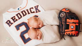 So cute! Photo of Reddick twins laying on father's jersey a sure home run