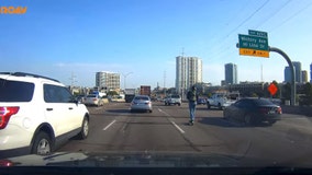 Dash camera captures Lime scooter rider on I-35 in downtown Dallas during rush hour