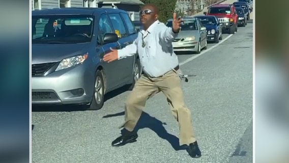 Video: Driver stuck in Baltimore traffic jam gets out, dances in street