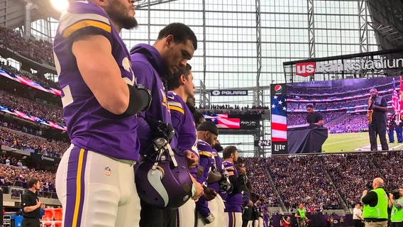 Minnesota Vikings all stand again for National Anthem