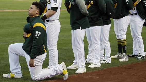 Oakland's Maxwell first MLB player to kneel during anthem