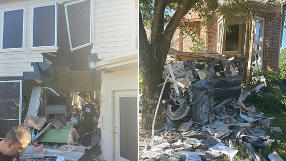 Driver charged after truck plows through Katy house, stopped by tree on the other side