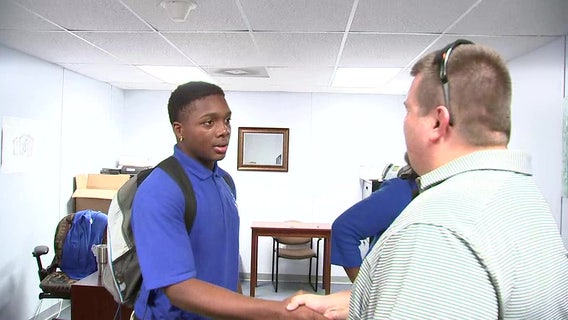 Revived high school athlete reunites with man who saved his life