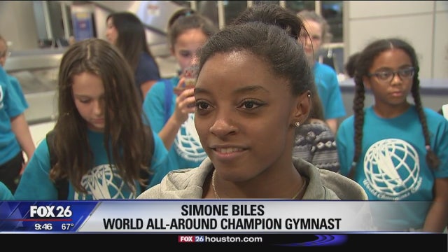 Record-setting Biles returns home to Houston