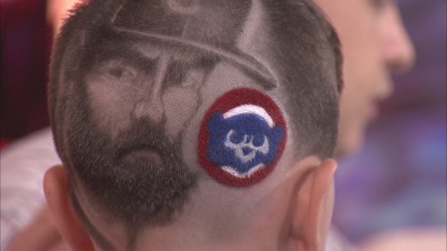 Barber shaves image of Arrieta into client's hair
