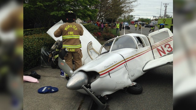 Small plane crashes on busy road in Washington state