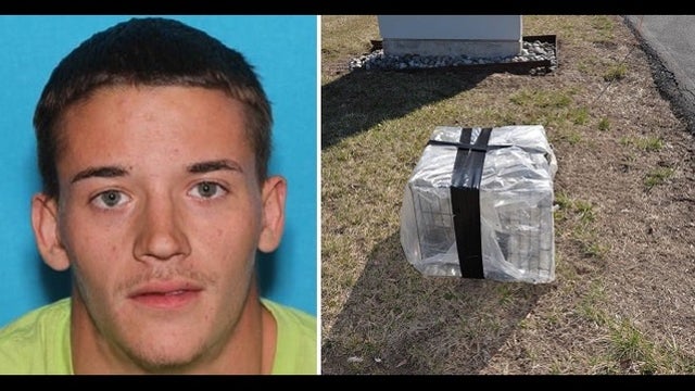 Man charged with death of dog found in cage