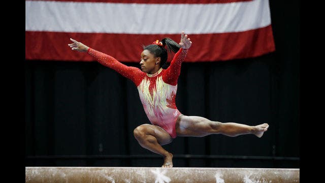Olympic champ Biles triumphs in return to competition