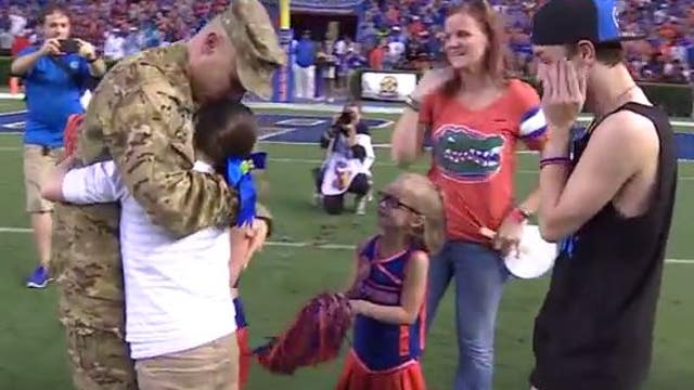 An emotional reunion as soldier surprises family at football game