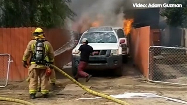 Man saves dog from house engulfed in flames