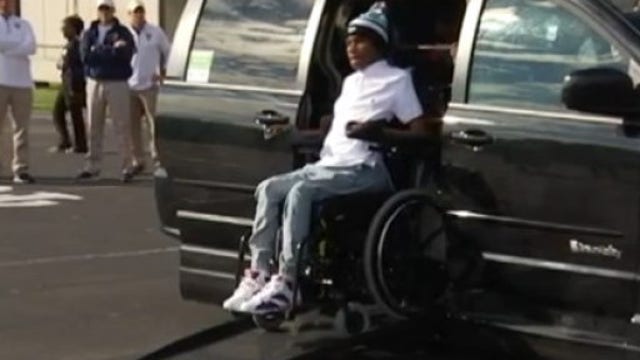 Paralyzed football player gets help from community