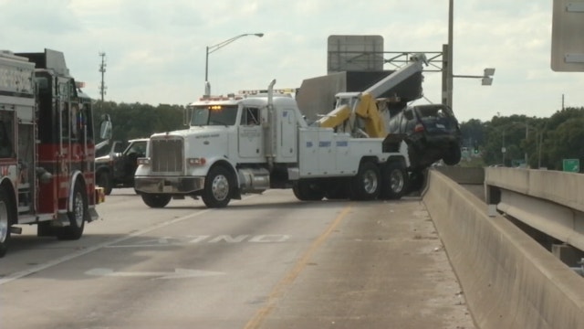 Crash leaves SUV dangling off  I-4 overpass